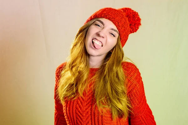 Close up face portrait of toothy smiling young woman wearing red — Stock Photo, Image