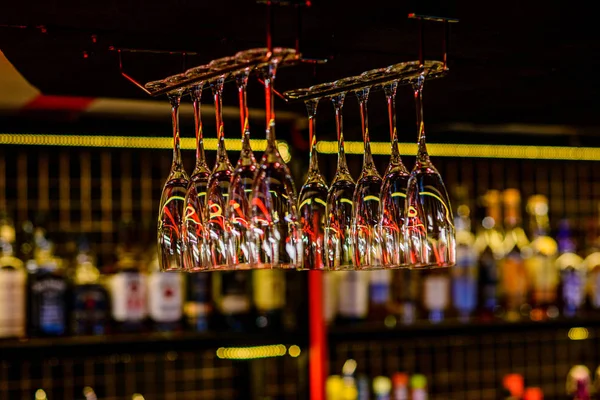 Glasses hanging above the bar in the restaurant.