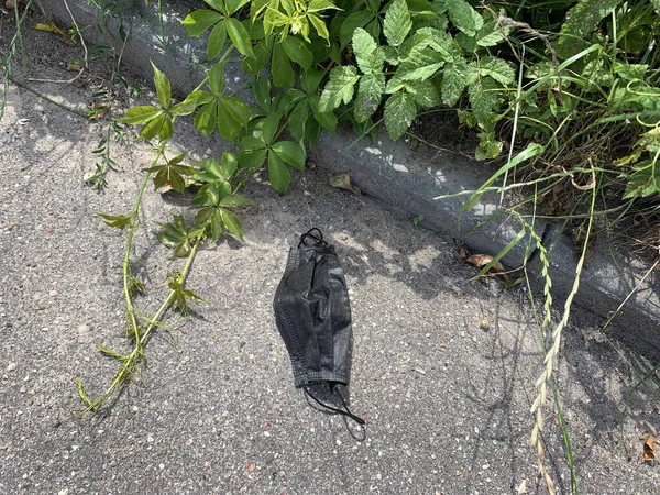 Used medical disposable masks lie on the ground during the Covid-19 pandemic. medical disposable masks lie on the ground during the Covid-19 pandemic. 2020. Belarus