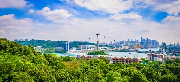 Panoramic landscape of Singapore port and cable cars. Cruise ship in the background. Viewpoint of Sentosa Island.