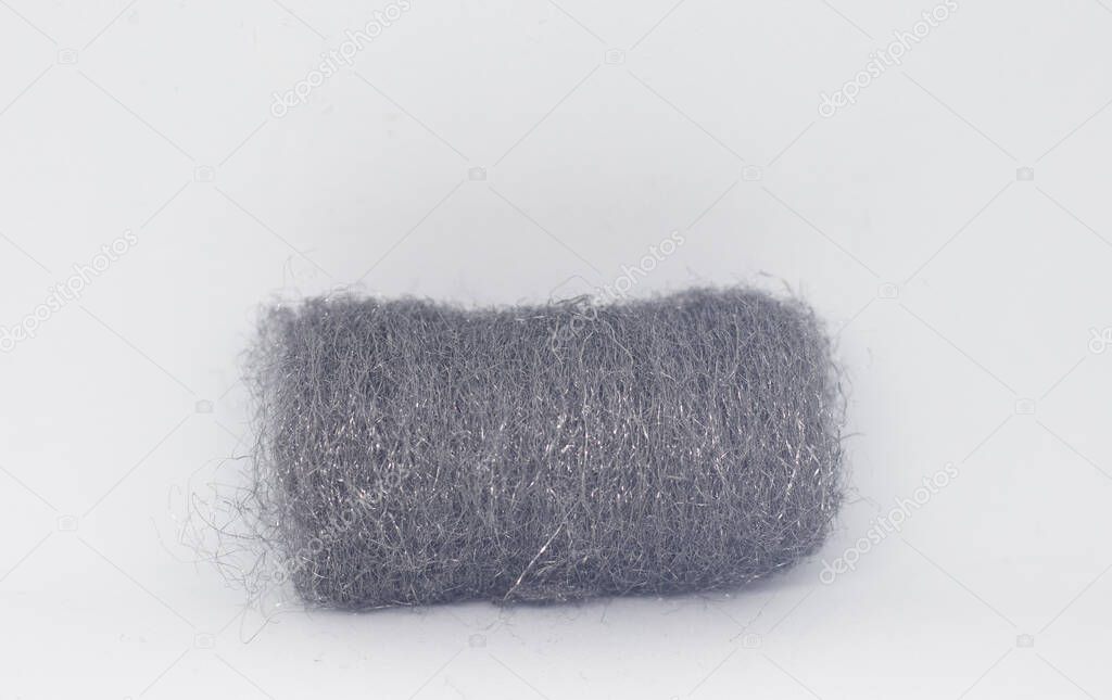 One piece of fine steel wool isolated on white background