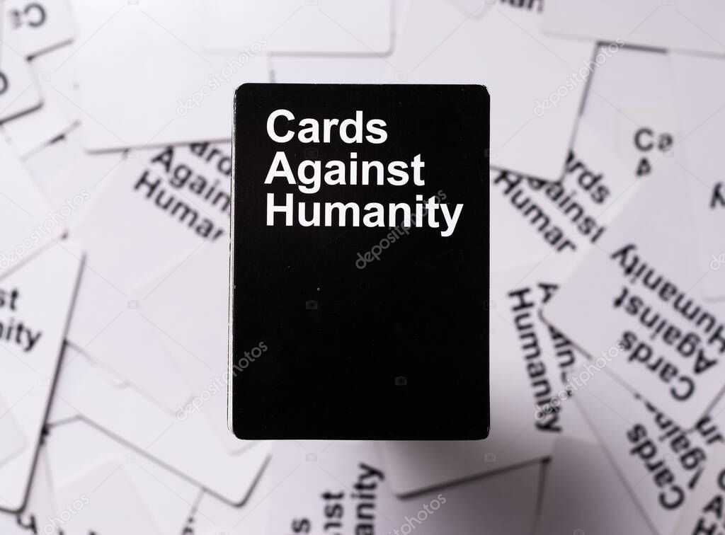 Split,Croatia April 2020 Cards against humanity deck stacked straight on top of other white cards in the background. Background cards readable as other CAH cards