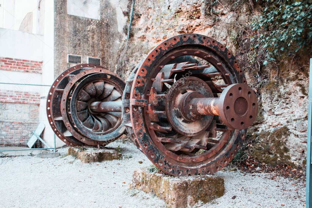 Old hydro turbine from Jaruga power plant, second hydro power plant in the world. Located near the river Krka, Croatia
