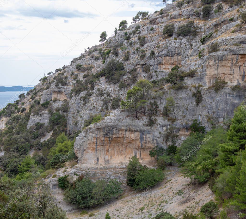 Cliffs surrounding the Pustinja Blaca, deserted remote area on the island of Brac in Croatia