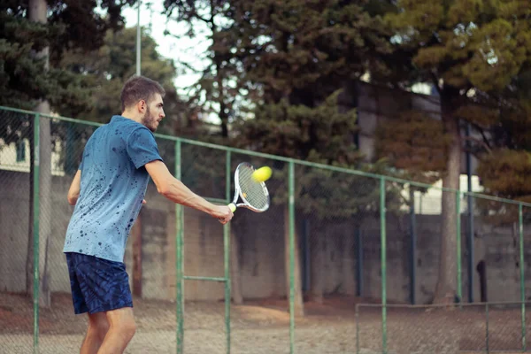 Young Adult Man Wearing Blue Shirt Blue Pants Hitting Ball — Stock Photo, Image