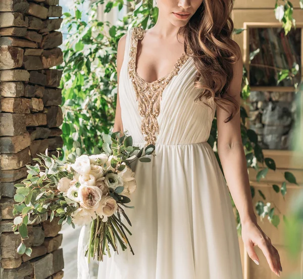 Romantic beautiful bride in luxury dress posing in hotel — Stock Photo, Image