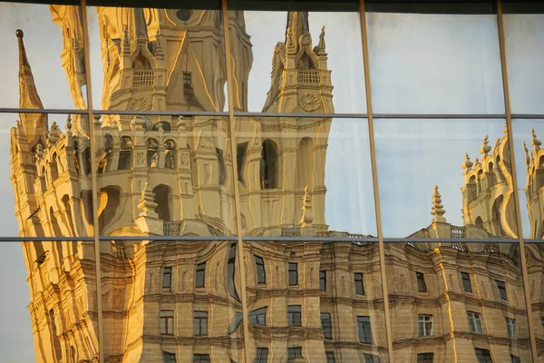 A large historic building is reflected and distorted in mirrors — Stock Photo, Image