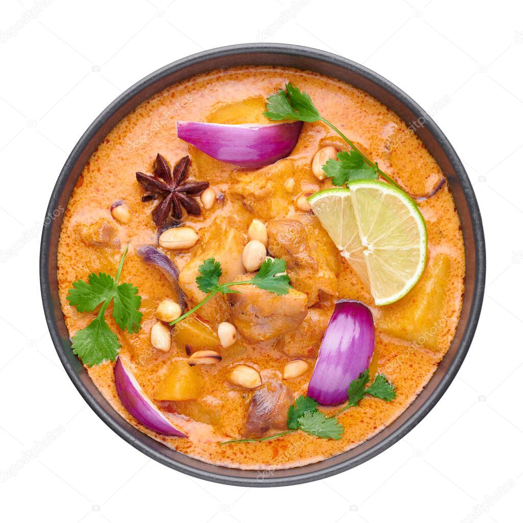A Chicken Massaman Curry in black bowl isoated on white background. Massaman Curry is Thai Cuisine dish with chicken meat, potato, onion and many spices. Thai Food. Isolate