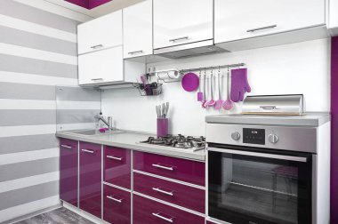 kitchen interior in purple, white and gray colours. Trendy ultraviolet kitchen room design. Modern home interior