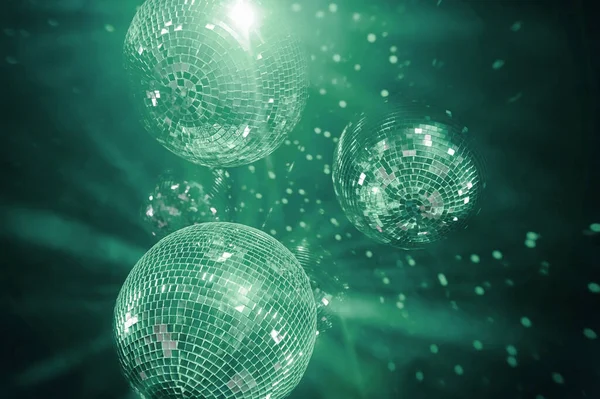 neo-mint shining disco balls. disco atmosphere concept in trendy 2020 tones