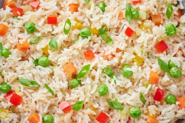 Veg Fried Rice close up texture. Veg Fried rice is indo chinese cuisine dish. Indian vegetarian meal. Asian food.