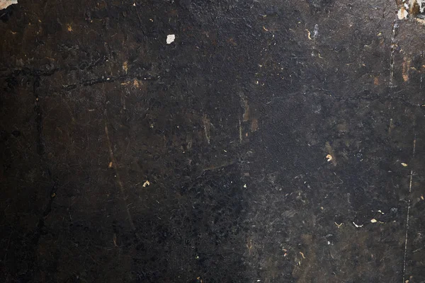 old dirty black wall texture with soot and spots. vintage background