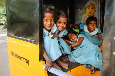 23 february 2018 Madurai, India, group of indian schoolgirls smiling to camera in tuk tuk rickshaw
