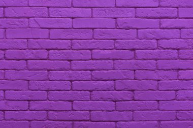 Ultraviyole tuğla duvar doymuş mor renkte boyanmış. Doku arkaplanını kapat