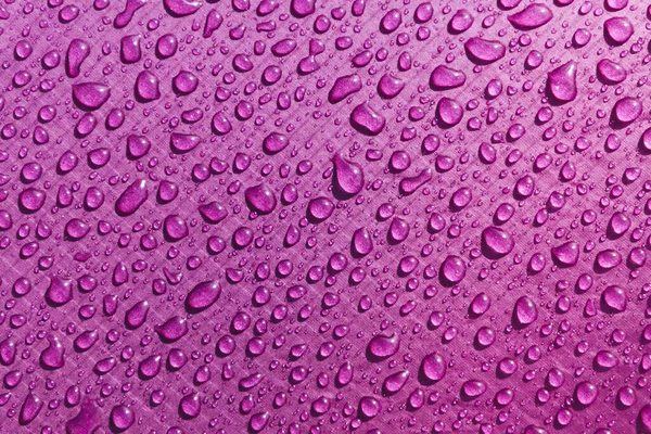 purple waterproof material, rip stop cloth with drops of water background