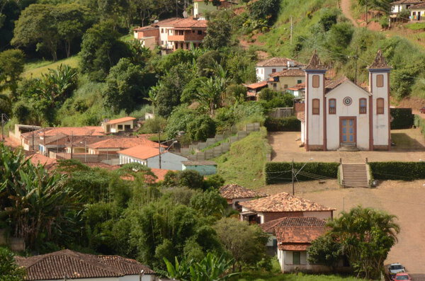 View of Serro/MG with Church Bom Jesus de Matozinhos at Serro/MG with blue sky in a sunny day with green trees