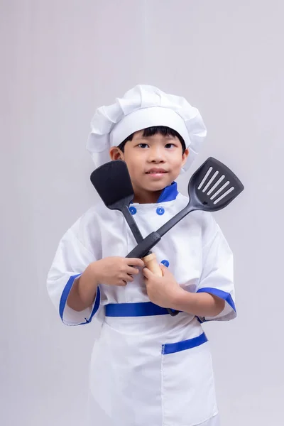 Roztomilý Chlapec Nosí Kuchař Uniformu Bílém Pozadí Stock Fotografie