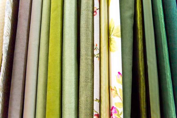 Rolls of fabric and textiles in a shop or store — Stock Photo, Image