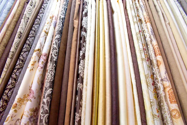 Rolls of fabric and textiles in a shop or store — Stock Photo, Image