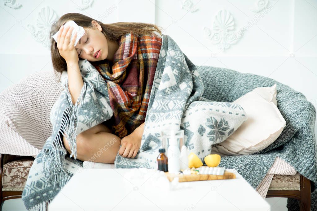ill young girl with fever spending time at home