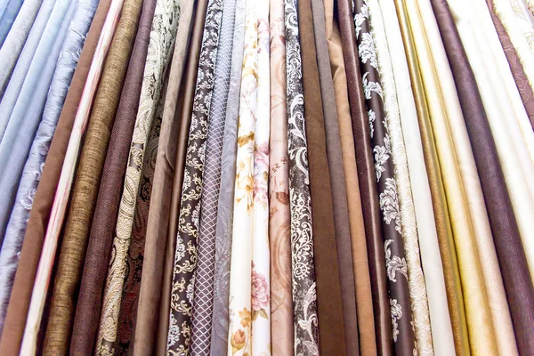 Rolls of fabric and textiles in a shop or store — Stock Photo, Image