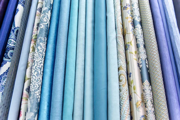 Rolls of fabric and textiles in a shop or store — Stock Photo, Image