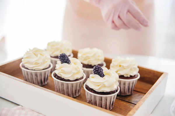 a concept of baking sweet cupcakes and muffins at home
