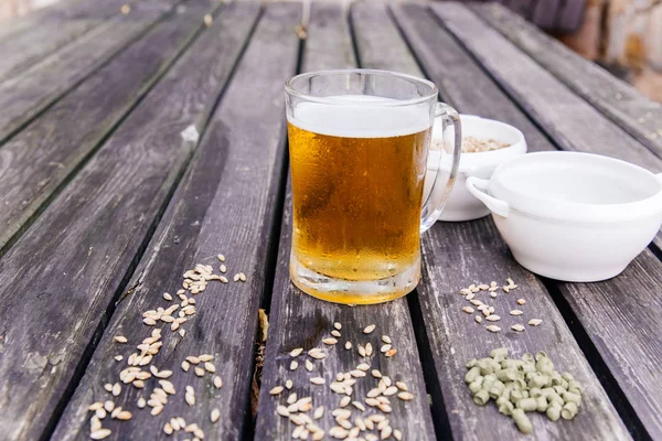 Glass of a tasty home made beer on table — Stock Photo, Image