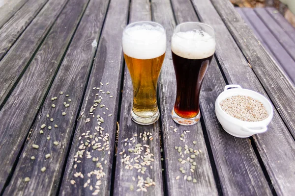 Glass of a tasty home made beer on table