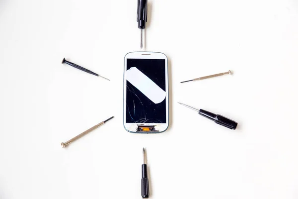 smartphone parts and repairing tools, flat lay, top view