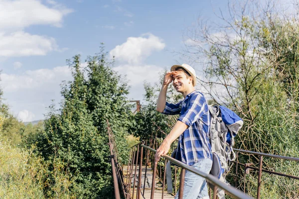 Young traveler guy hiking with backpack in the nature — Stock Photo, Image