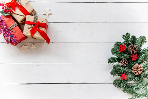 Christmas presents and boxes on wooden background — Stock Photo, Image