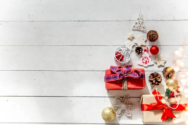 Christmas presents and boxes on wooden background — Stock Photo, Image