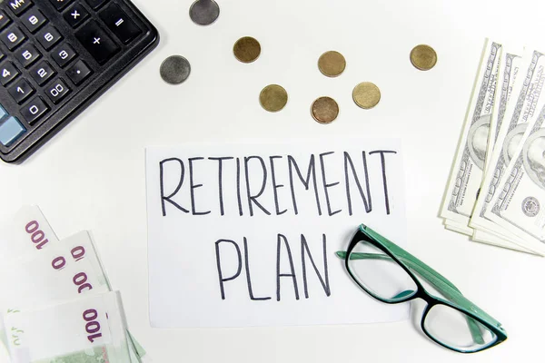 retirement fund concept - money and a calculator