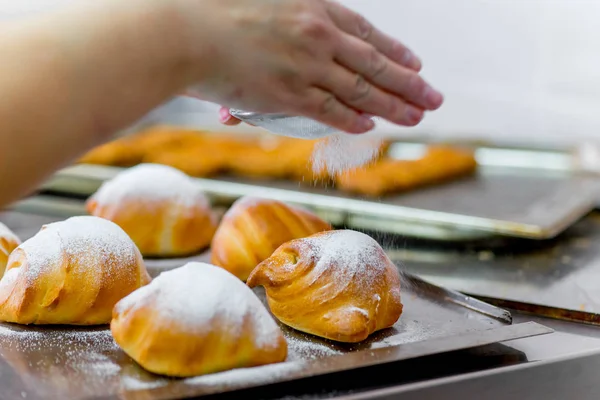 different kinds of pastry are cooked in a modern bakery