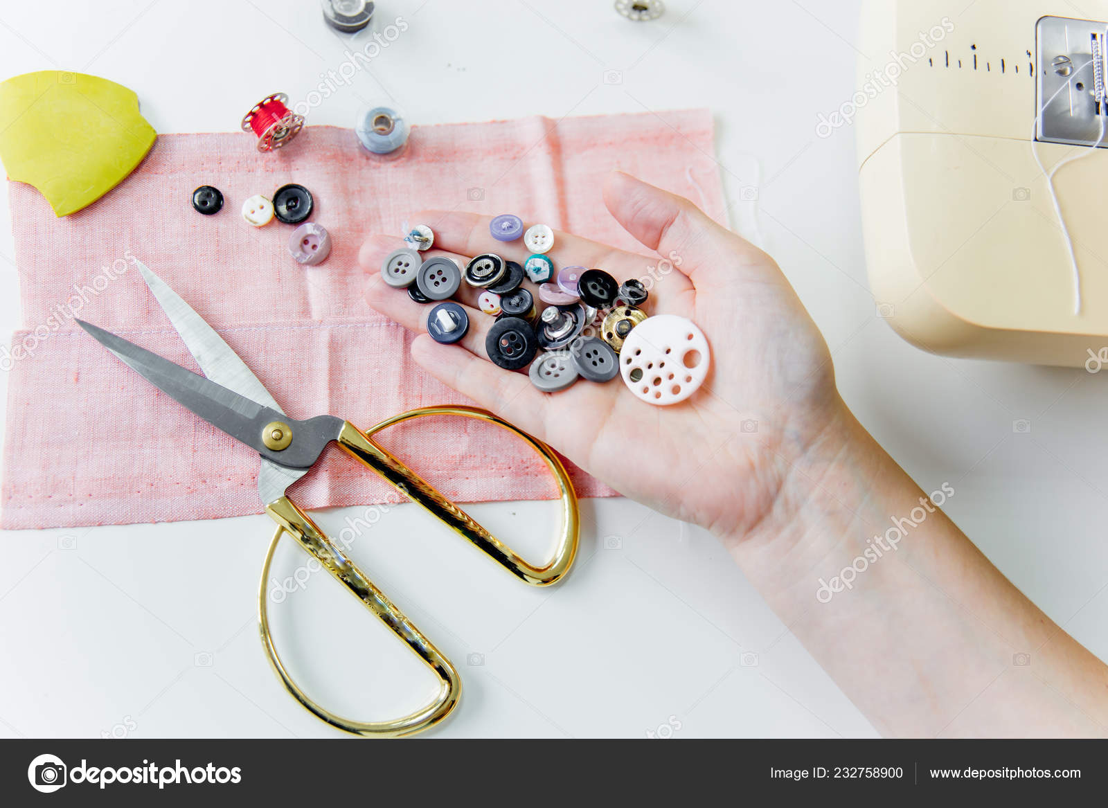 Creative sewing supplies and accessories on a table Stock Photo by