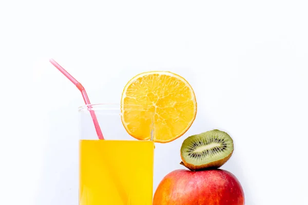 Different fruit and juice or smoothie in a glass — Stock Photo, Image