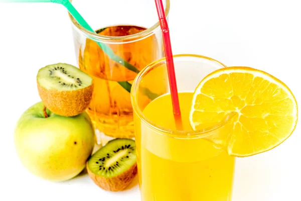 Different fruit and juice or smoothie in a glass — Stock Photo, Image