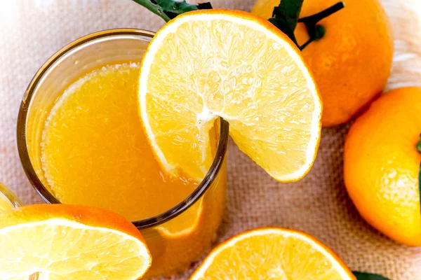 Different fruit and juice or smoothie in a glass — Stock Photo, Image