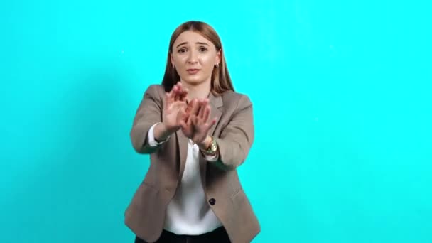 Frightened adult woman in a business suit, closing her eyes and reaching out — Stock Video