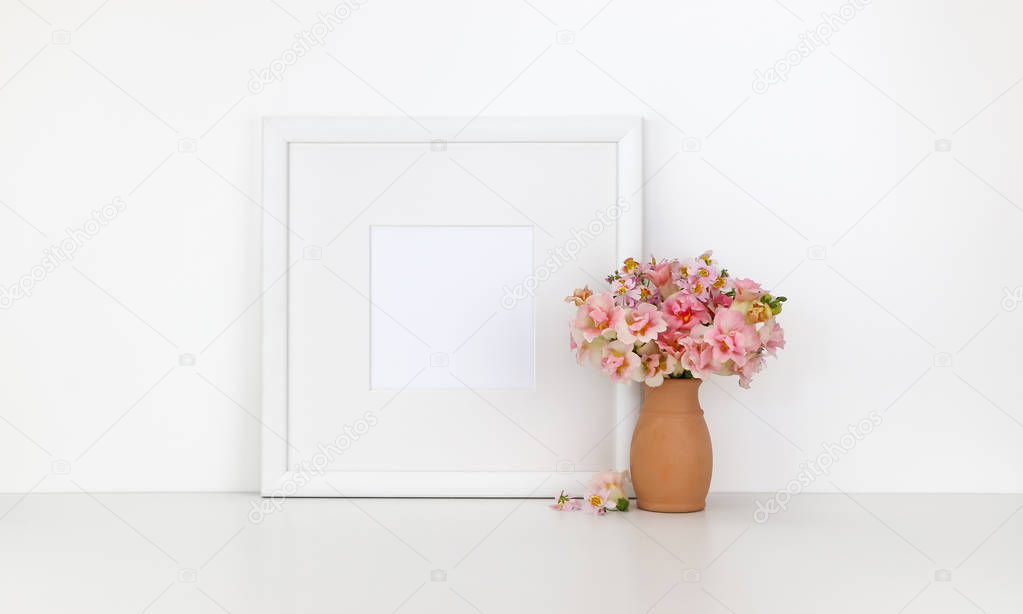 Square frame mockup on white background, flowers