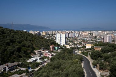 Vlore/Vlora, Albania - August 14 2020: Albania, Vlore/ Vlora, cityscape seen from Kanin. Aerial city view, city panorama of Vlore city center clipart