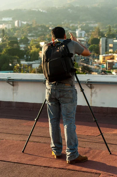 Photographer on his back on rooftop