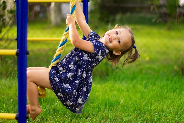 Little Cute Smiling Girl Climbs Rope Children Outdoor Playground — Stock Photo, Image