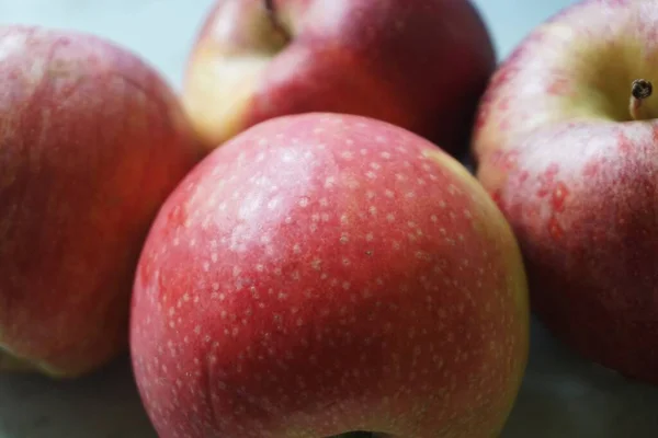 four red apples - macro photo