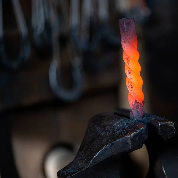 Close up of hot iron in blacksmith\'s workshop