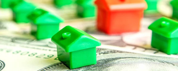 how to choose the perfect house for everyone, green little houses in row on dollar banknotes