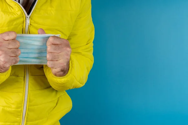 Man Yellow Jacket Using Protective Mask Corona Virus Blue Background — Stock Photo, Image