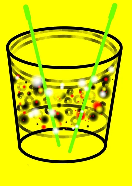 黄底玻璃杯中的绿色稻草 — 图库照片