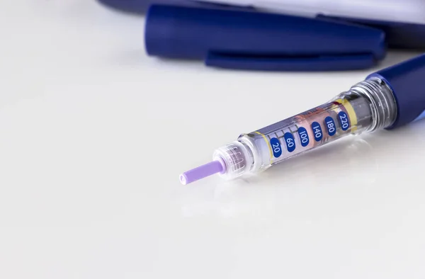 Insulin pen, syringe pen, glucometer. Isolate. White background. Medicine, diabetes, health and healthcare concept. Close up. Copy space.